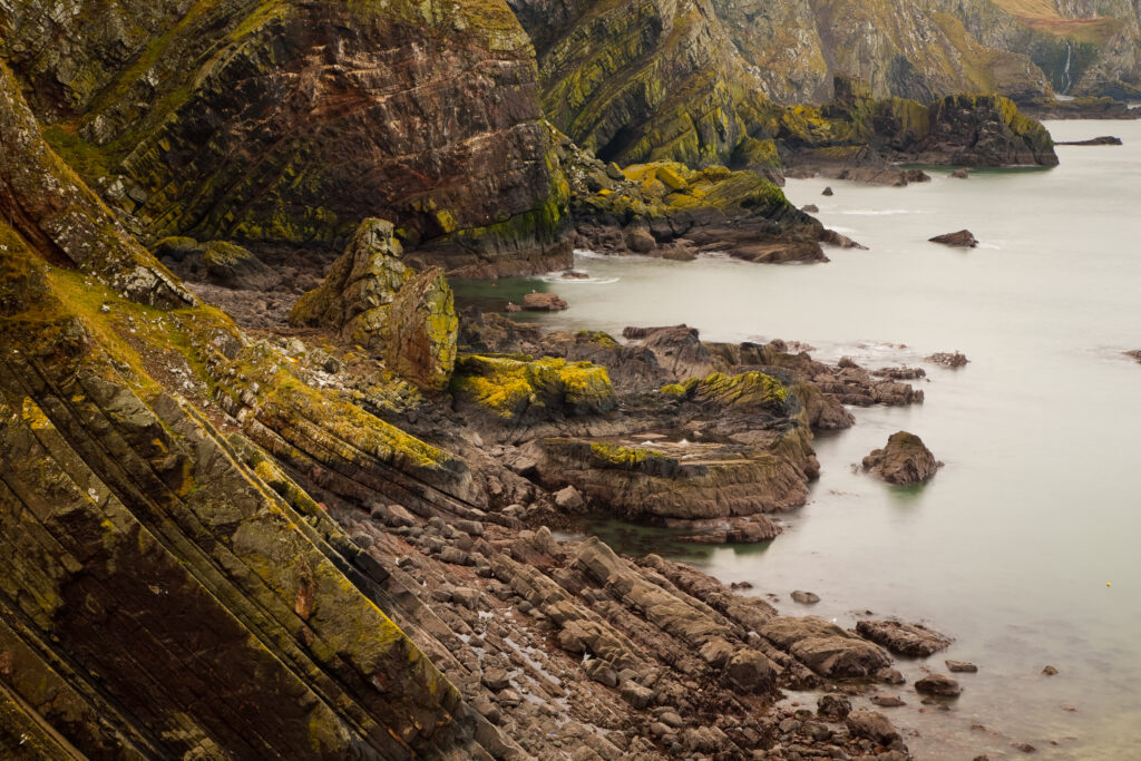 Scotland, Scottish Borders, Wauchope Forest. Uplifted rock layers at Petticot Wick near St Abbs.