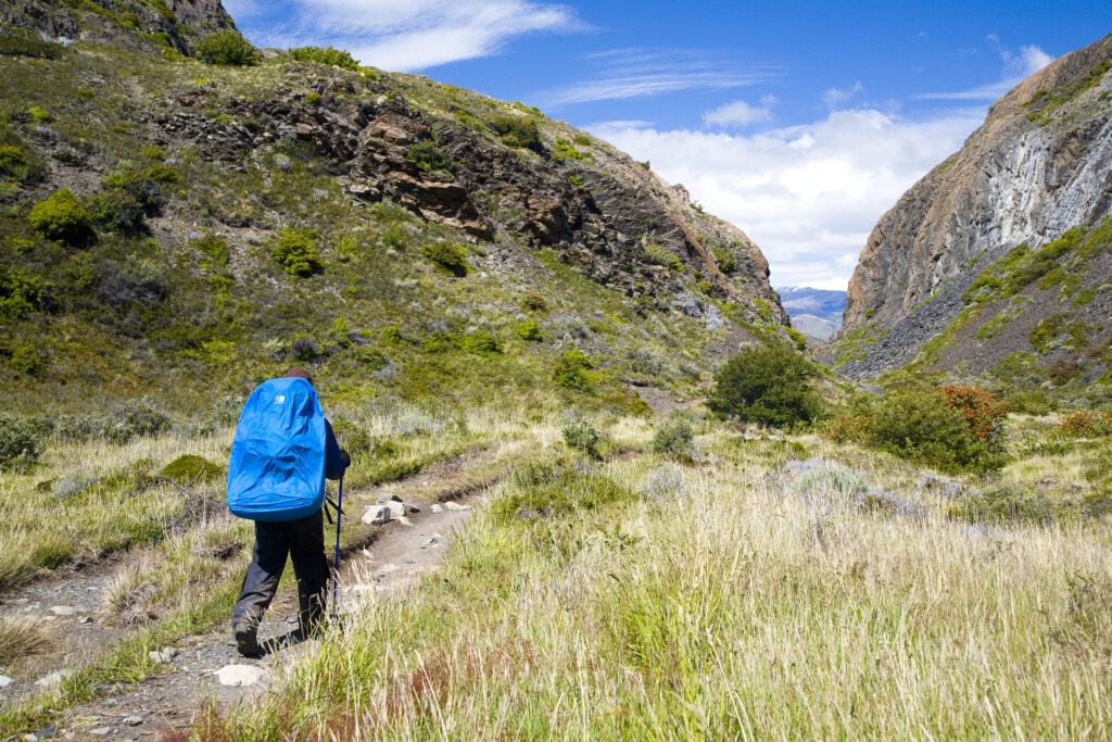 Chile, Southern Patagonia, Torres Del Paine National Park. Hiker walking the circuit / W track heading towards the Pehoe refuge.