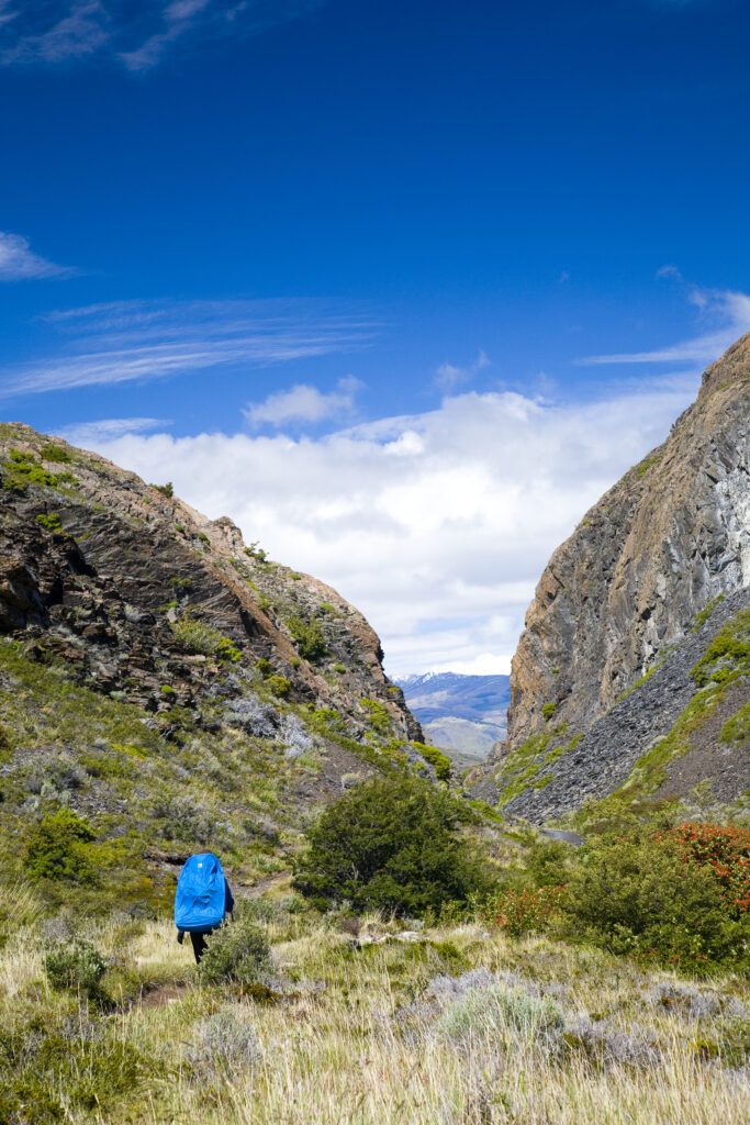 Chile, Southern Patagonia, Torres Del Paine National Park. Hiker walking the circuit / W track heading towards the Pehoe refuge.