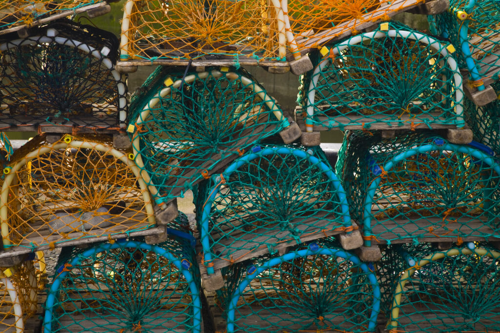 Scotland, Scottish Borders, Eyemouth. Sea fishing lobster pots stacked in the harbour of Eyemouth.