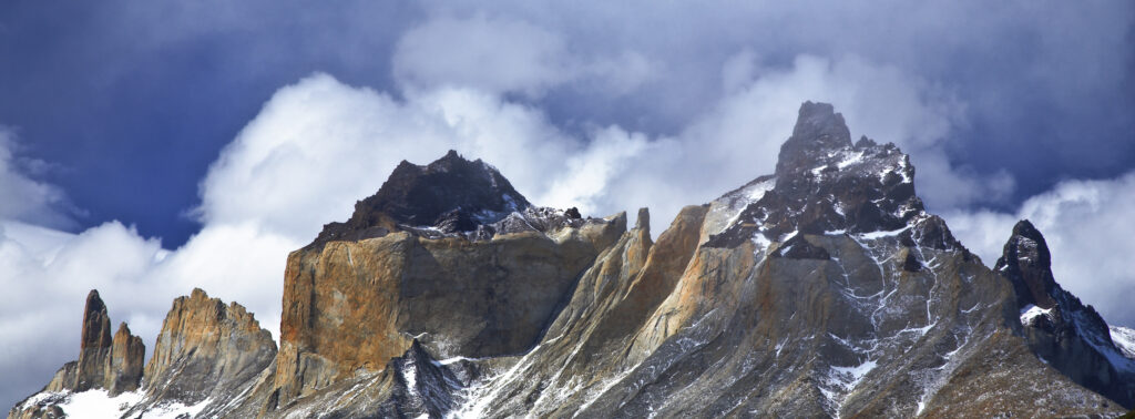 Chile, Southern Patagonia, Torres Del Paine National Park. Late afternoon light illuminates the peaks of the Cuernos del Paine.