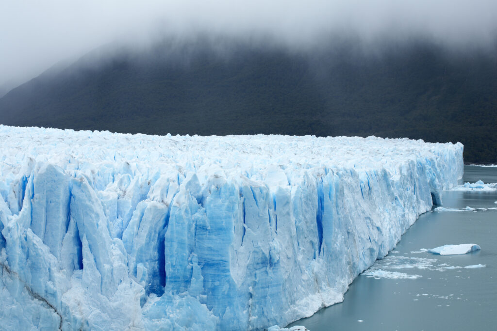 Argentina, Patagonia, Los Glaciares National Park. Rain clouds hang over the Perito Moreno Glacier.