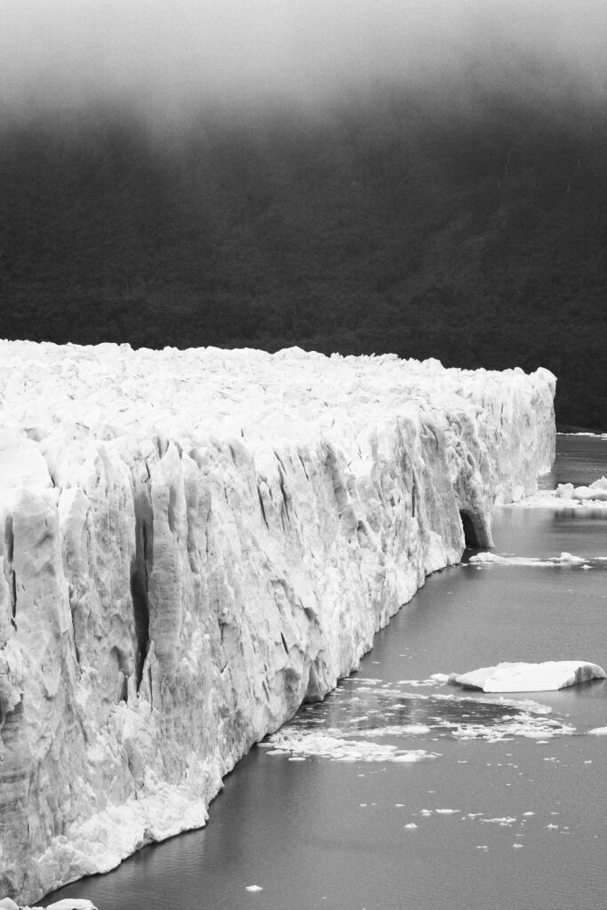 Argentina, Patagonia, Los Glaciares National Park. Rain clouds hang over the Perito Moreno Glacier.