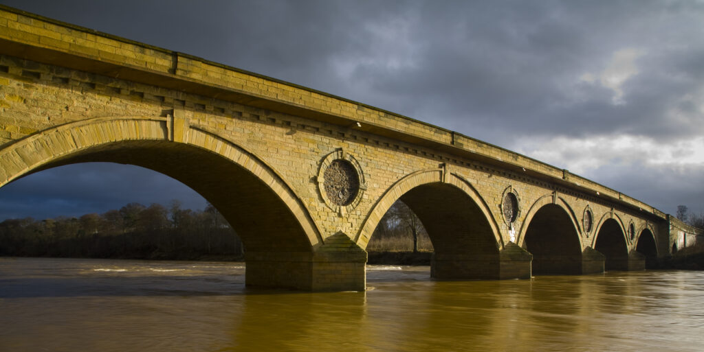 Scotland, Scottish Borders, Coldstream. Smeaton's seven arched bridge near Coldstream, was constructed between 1763 to 1766. Robert Burns famously crossed the bridge into England for the first time on the 7th May 1787.