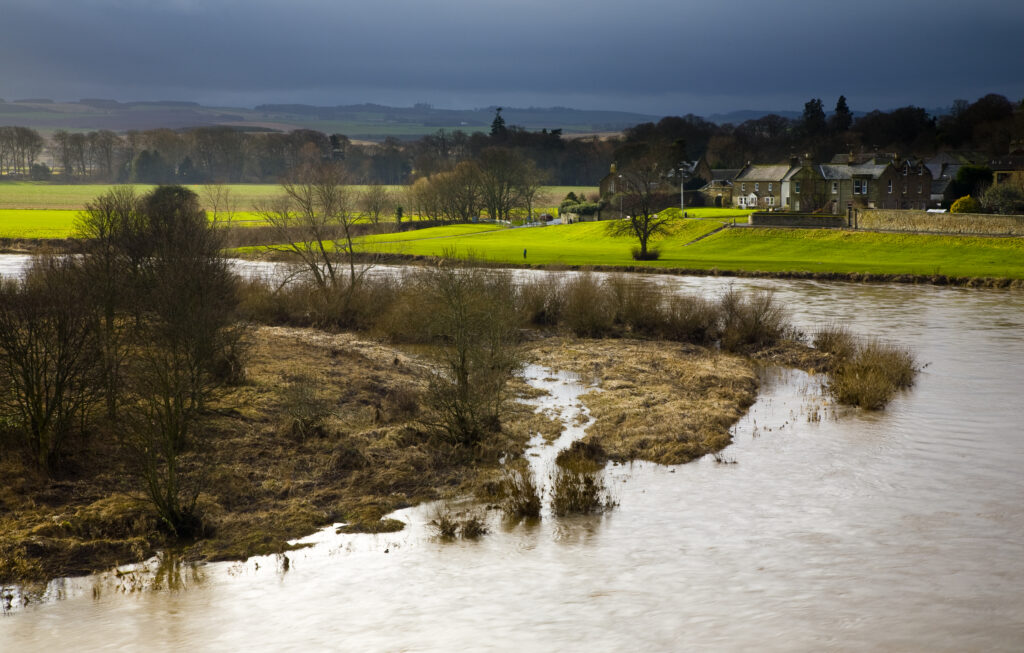 Scotland, Scottish Borders, Coldstream. Looking across the River Tweed, the natural border between England and Scotland.