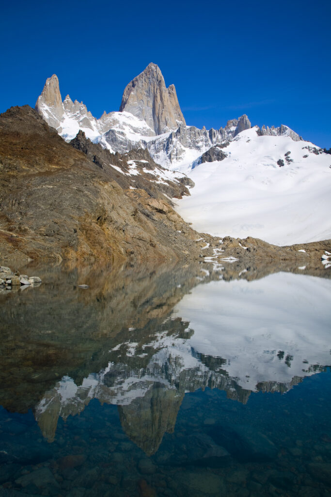 Argentina, Patagonia, Los Glaciares National Park. Fitz Roy and surrounding mountains reflected in the de los tres lake.