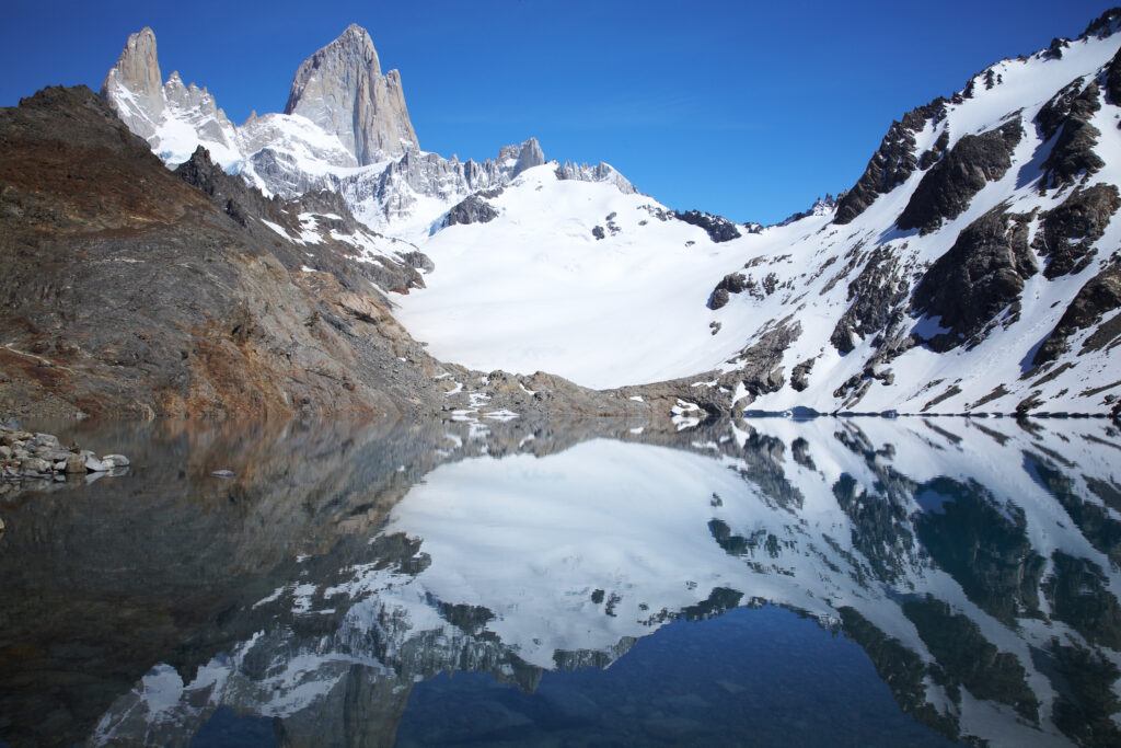 Argentina, Patagonia, Los Glaciares National Park. Fitz Roy and surrounding mountains reflected in the still waters of the 'de los tres' lake.