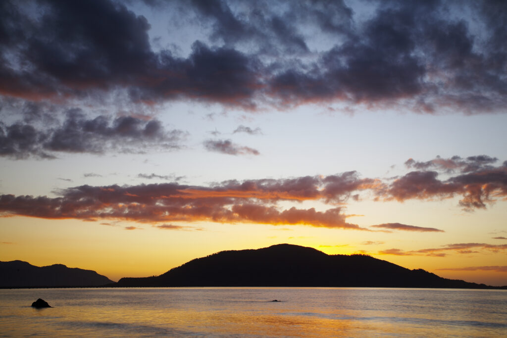 Chile, Northern Patagonia, Chaiten. Sunset looking across a patagonian fiord near the ferry port of Chaiten.