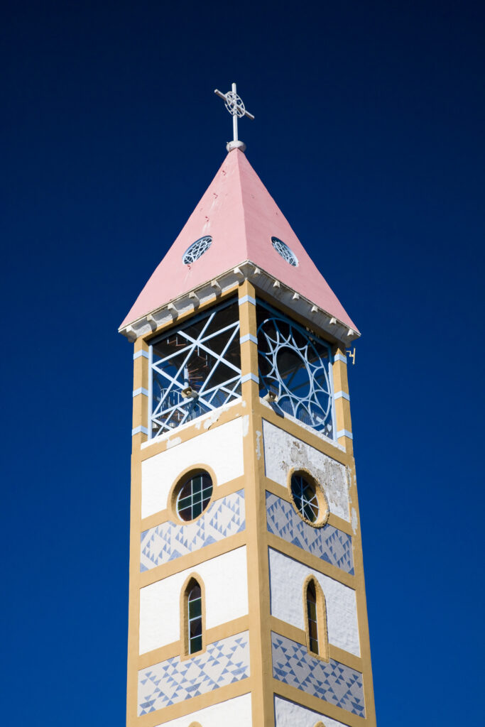 Argentina, The Lake District, Junín De Los Andes. Church tower against a blue sky in Junín De Los Andes.