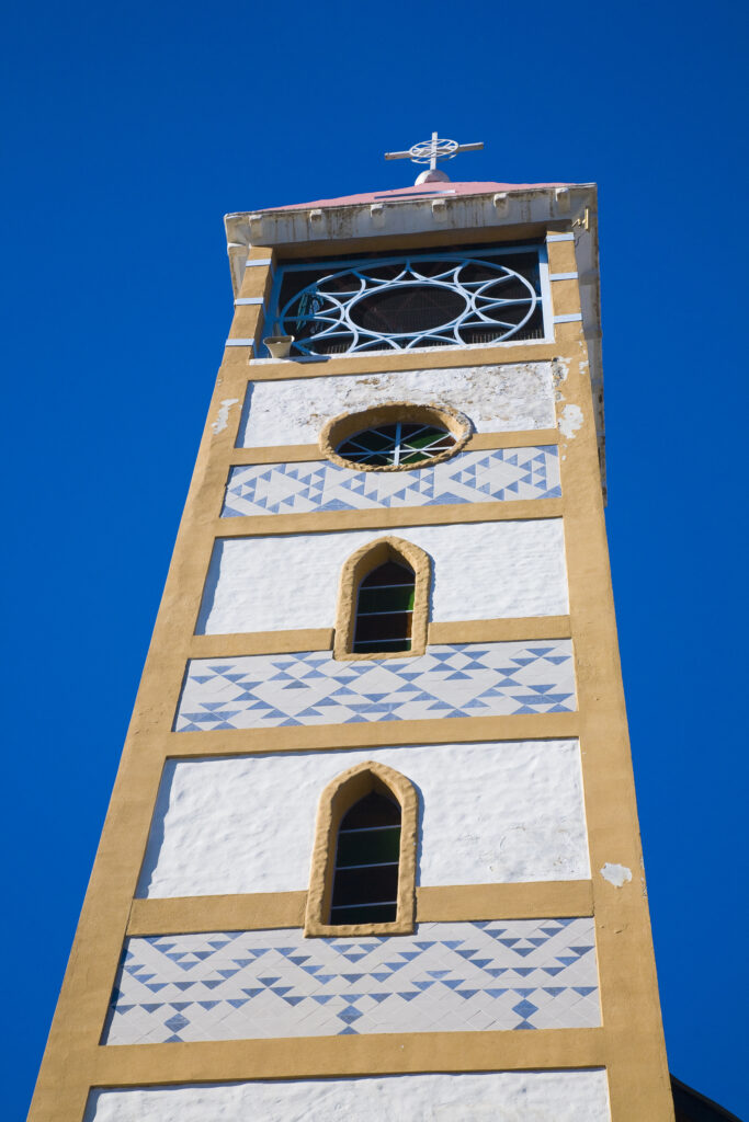 Argentina, The Lake District, Junín De Los Andes. Church tower against a blue sky in Junín De Los Andes.