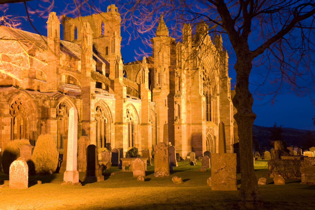 Scotland, Scottish Borders, Melrose. The magnificent ruins of the Melrose Abbey, considered to be the final resting place of the heart of Robert the Bruce.