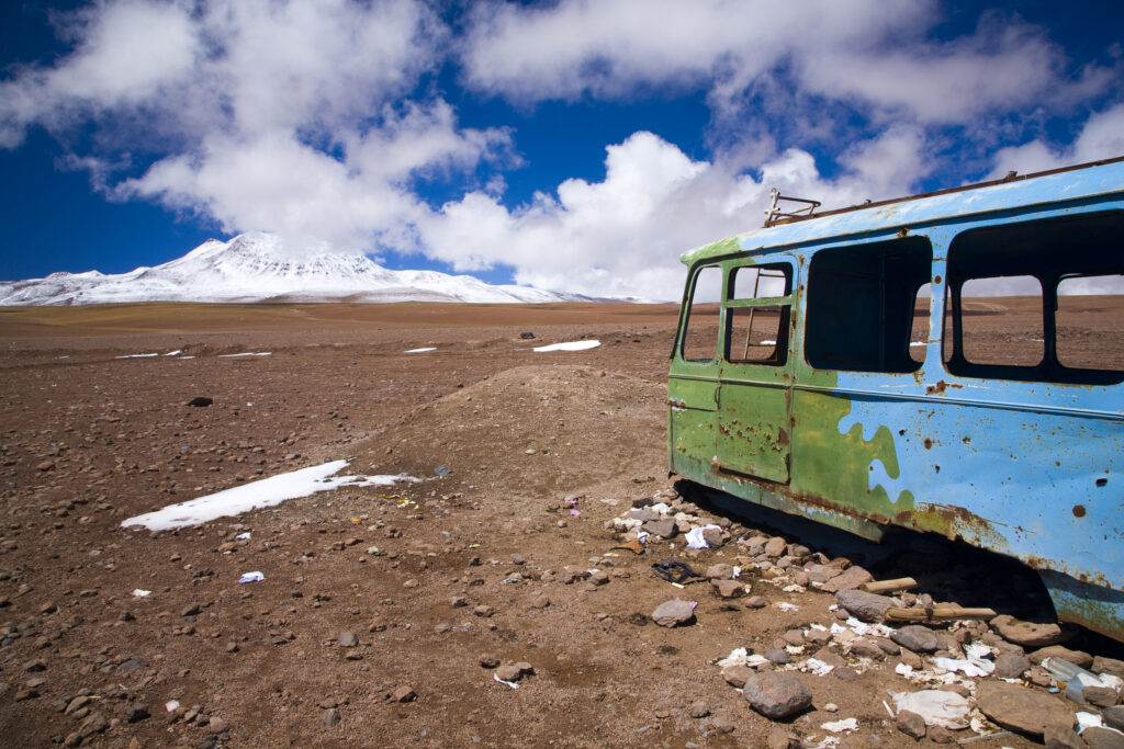 Bolivia, Southern Altiplano, Portezuelo del Cajon. Abandonded bus shell rustin near the Chilean Border.