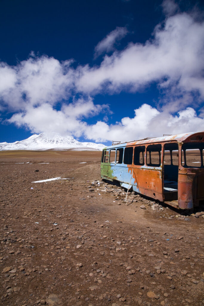 Bolivia, Southern Altiplano, Portezuelo del Cajon. Abandonded bus shell rustin near the Chilean Border.
