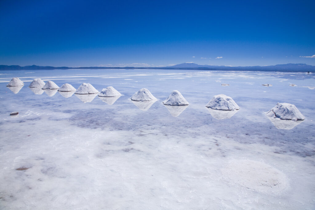 Bolivia, Southern Altiplano, Salar de Uyuni. Cones of salt stacked on the Salar de Uyuni salt flat.