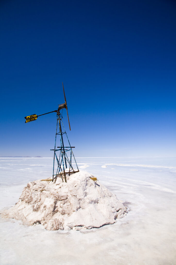 Bolivia, Southern Altiplano, Salar de Uyuni. Wind vane situated upon a mound of salt in the Salar de Uyuni salt flat.