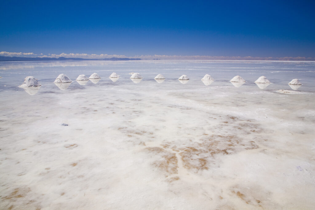 Bolivia, Southern Altiplano, Salar de Uyuni. Cones of salt stacked on the Salar de Uyuni salt flat.