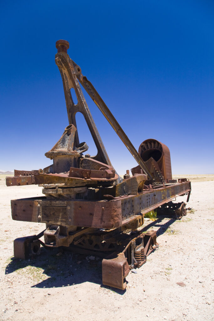 Bolivia, Southern Altiplano, Uyuni. Rusty railway vehicle within a train cementary near Uyuni.