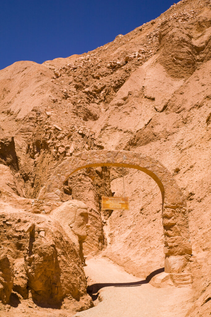Chile, Atacama Desert, Plaza Quitor. Carved face in the stone wall of the Atacama Desert near the Plaza Quitor.