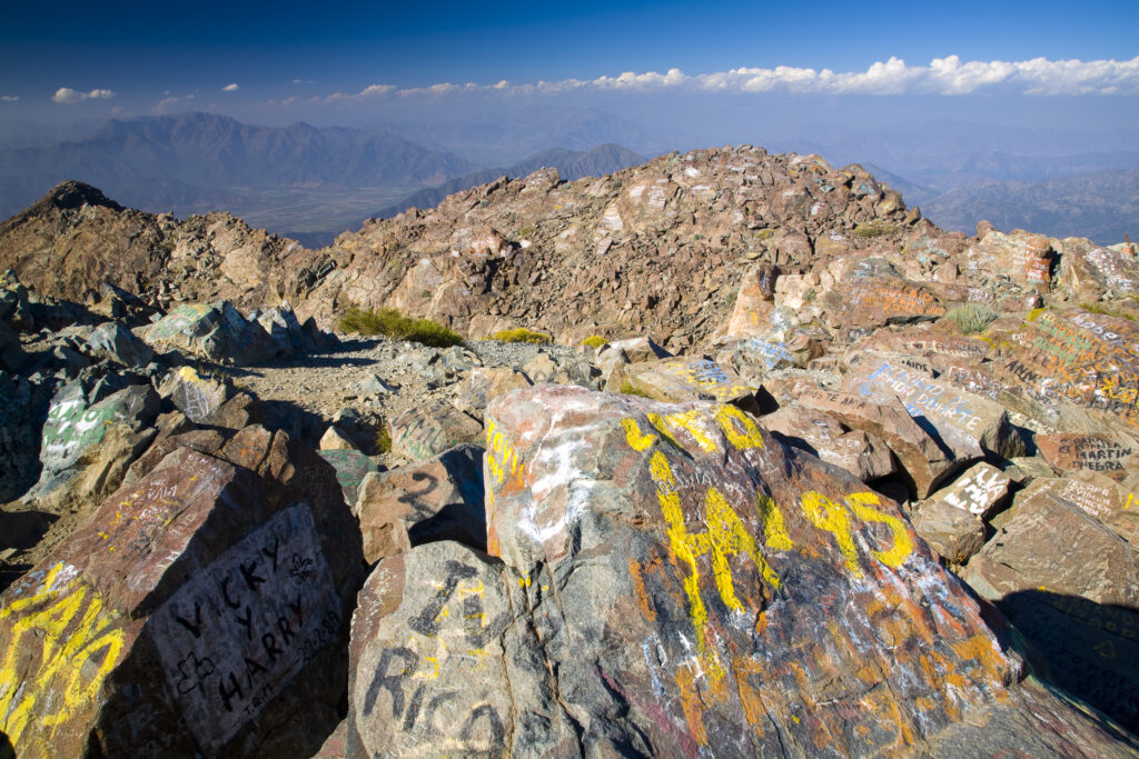 Chile, Valparaíso V, Parque Nacional La Campana. Graffiti on the rocks of the mountain peak of Cerro La Campana.