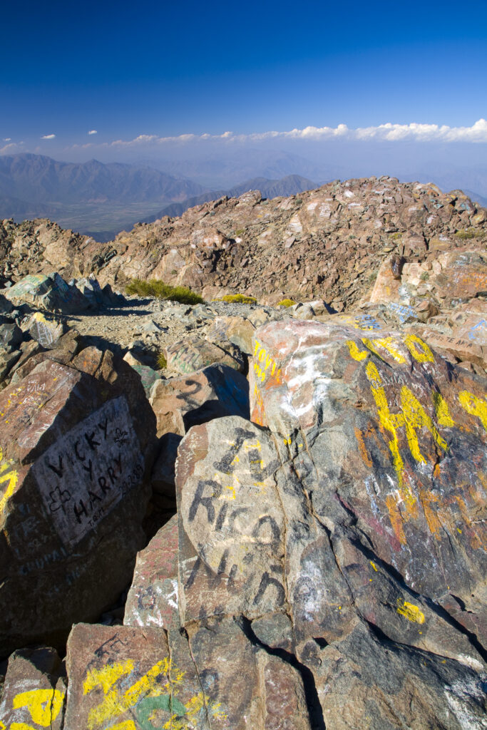 Chile, Valparaíso V, Parque Nacional La Campana. Graffiti on the rocks of the mountain peak of Cerro La Campana.