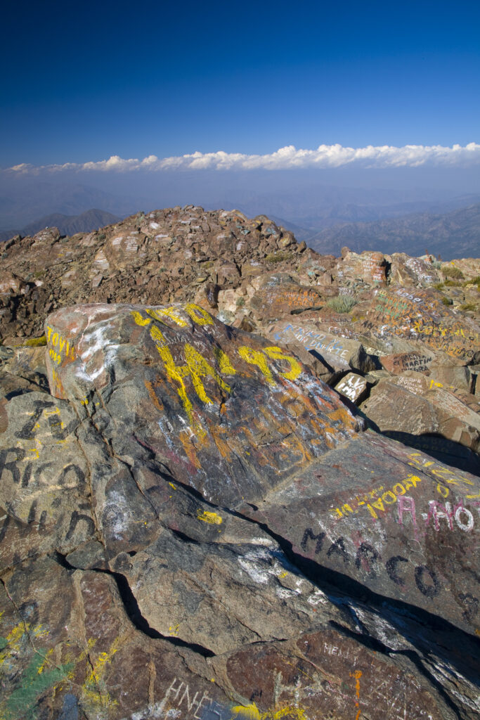 Chile, Valparaíso V, Parque Nacional La Campana. Graffiti on the rocks of the mountain peak of Cerro La Campana.