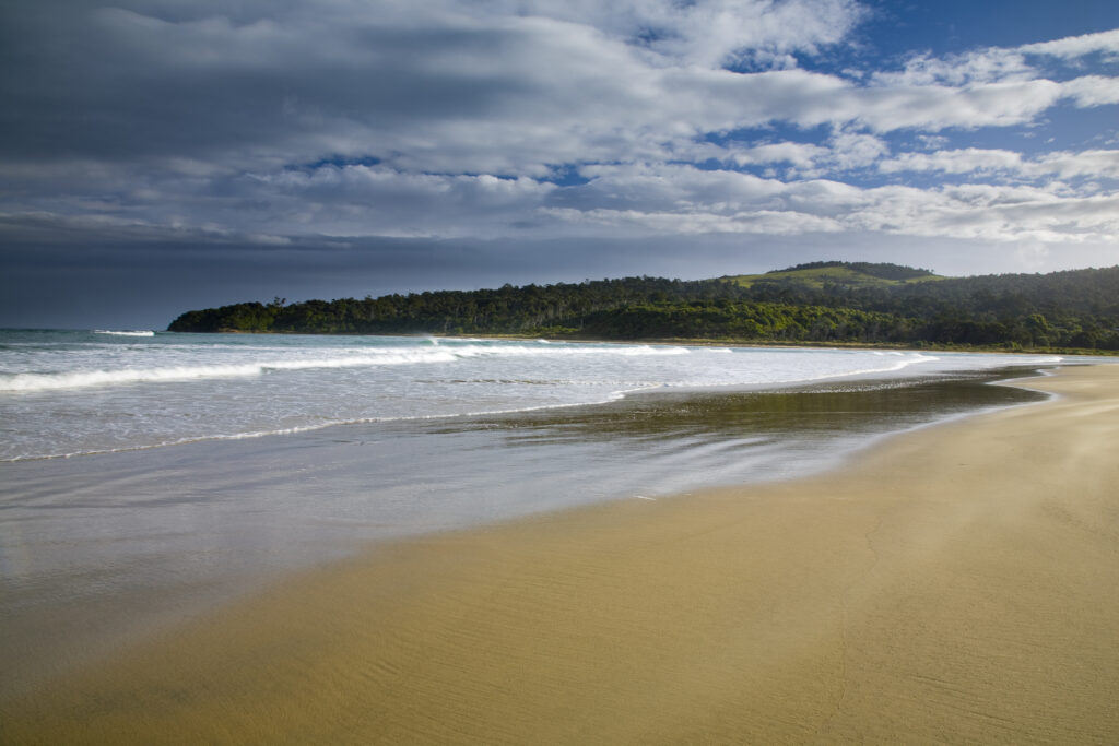 New Zealand, Southland, The Catlins. A storm clears from above Tahakopa Bay near the town of Papatowai.