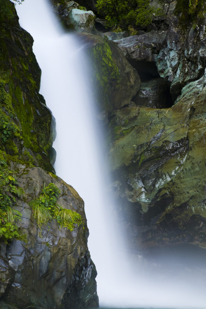 New Zealand, Southland, Fiordland National Park. The Hidden Falls cascade, found along the route of the Hollyford Track.