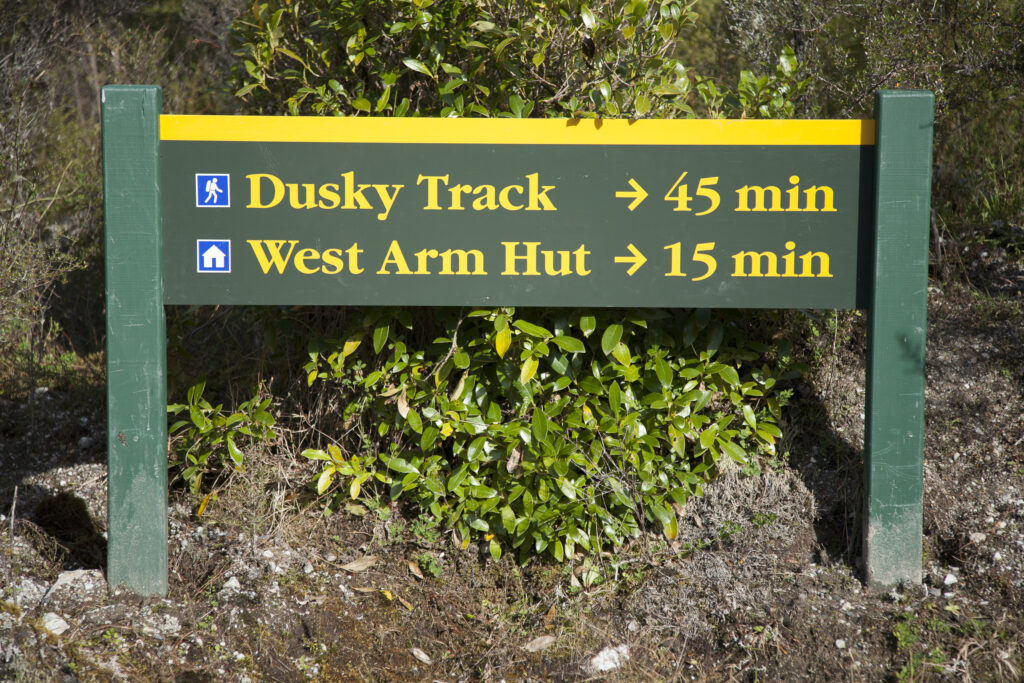 New Zealand, Southland, Fiordland National Park. Sign to indicate the route of the 'Dusky Track' near West Arm Hut.