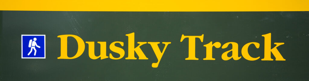 New Zealand, Southland, Fiordland National Park. Sign to indicate the route of the 'Dusky Track' near West Arm Hut.