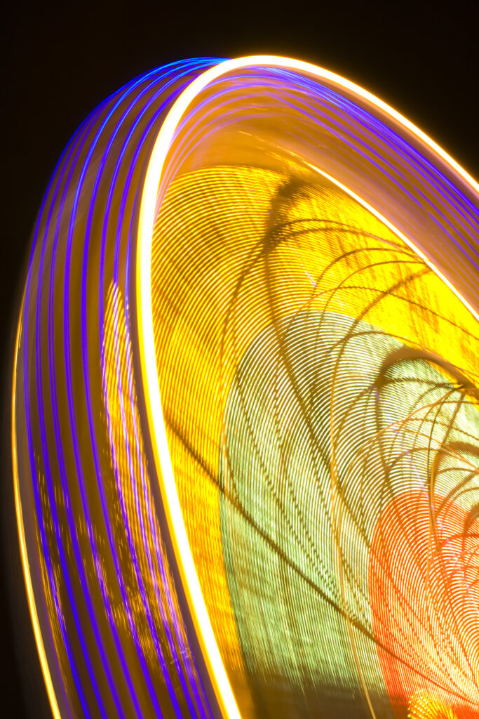 Scotland, Edinburgh, Christmas Fair. A Ferris wheel forming part of the city Christmas fair held near the Scott Monument in East Princes Street Gardens.