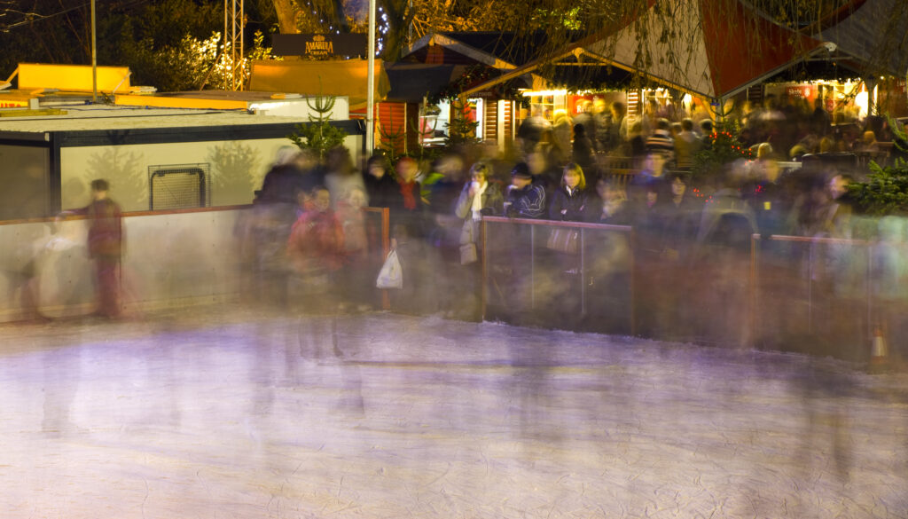 Scotland, Edinburgh, Christmas Fair. Ice rink in the East Princes Street Gardens.
