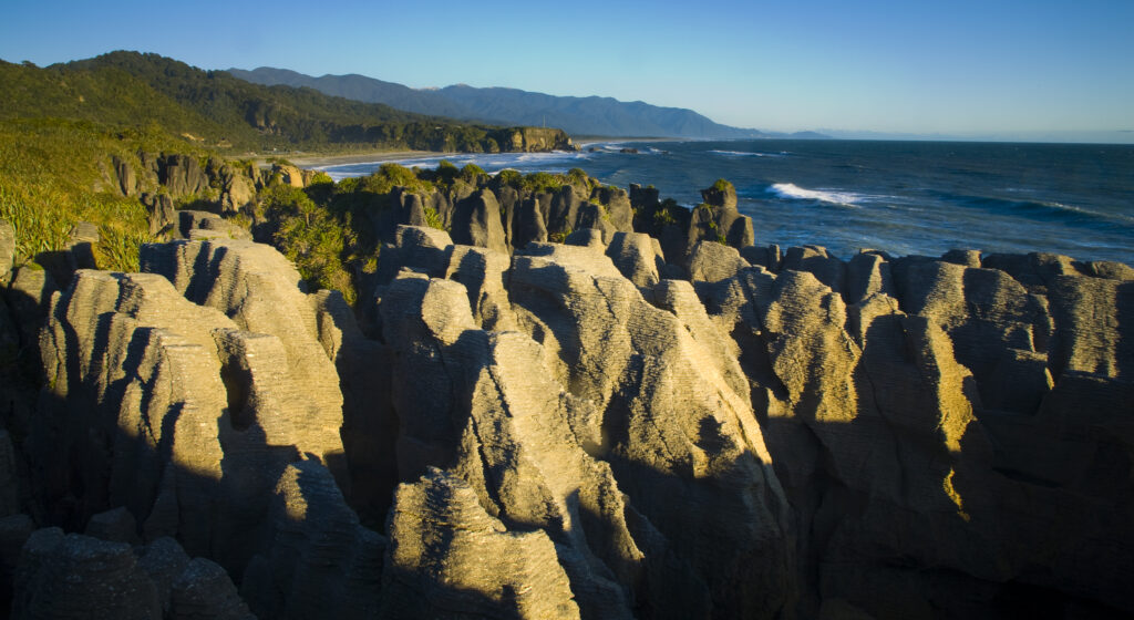 New Zealand, Westland, Punakaiki. The limestone columns known as the Punakaiki Pancake Rocks, located within the Paparoa National Park.