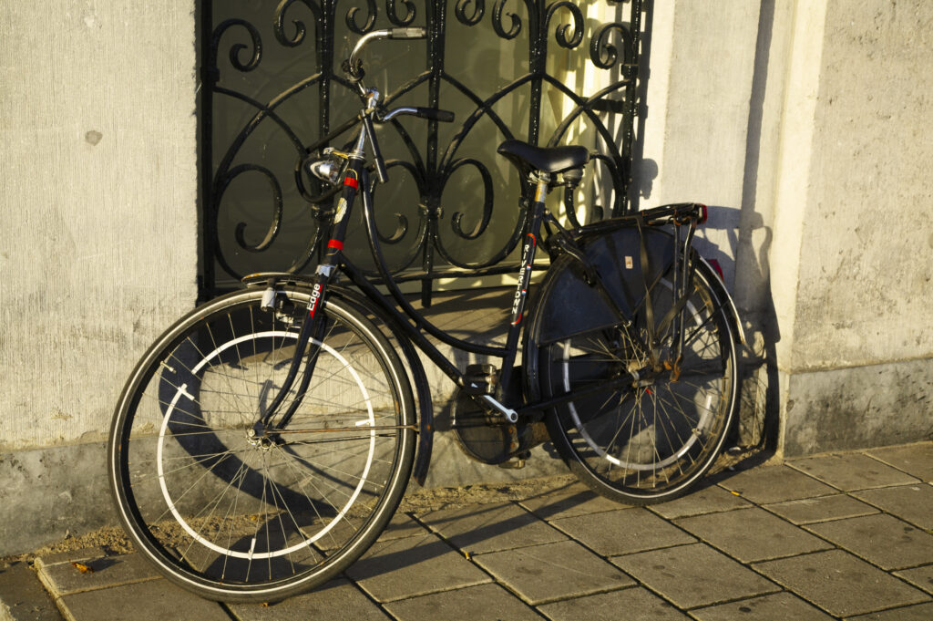 Netherlands, North Holland, Amsterdam. Bicycle left outside a building in Amsterdam City.