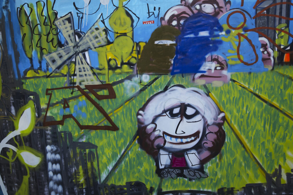 Netherlands, North Holland, Amsterdam. Graffiti sprayed / painted on a temporary fence panel in Amsterdam City.
