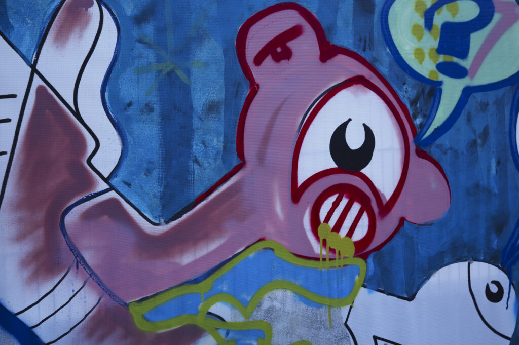 Netherlands, North Holland, Amsterdam. Graffiti sprayed / painted on a temporary fence panel in Amsterdam City.