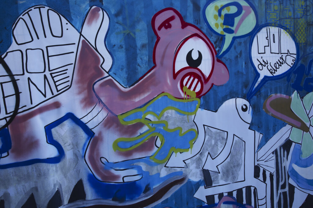 Netherlands, North Holland, Amsterdam. Graffiti sprayed / painted on a temporary fence panel in Amsterdam City.