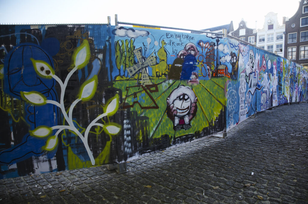 Netherlands, North Holland, Amsterdam. Graffiti sprayed / painted on a temporary fence panel in Amsterdam City.