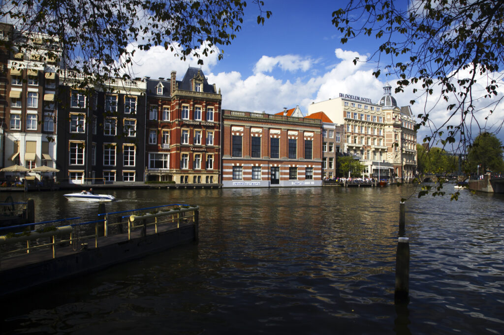 Netherlands, North Holland, Amsterdam. The oldest Hotel in Amsterdam, The NH Doelen Hotel, located on the banks of the River Amstel in Amsterdam City.