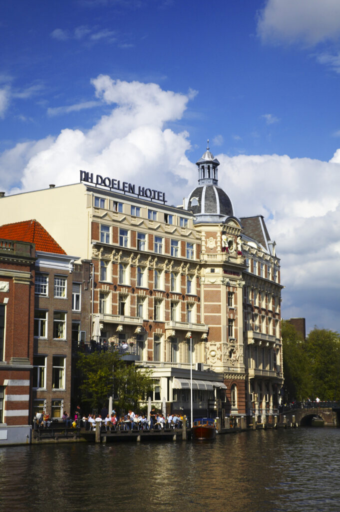 Netherlands, North Holland, Amsterdam. The oldest Hotel in Amsterdam, The NH Doelen Hotel, located on the banks of the River Amstel in Amsterdam City.
