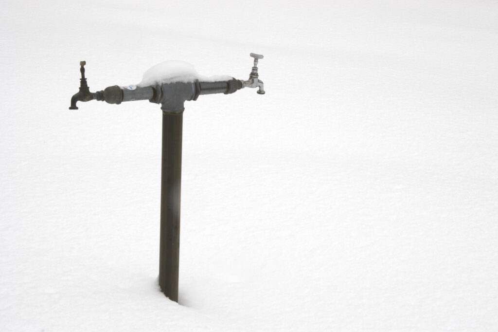 Norway, Oslo, Oslo City. Frozen water tap in the grounds of Bogstad camping in Oslo Forest near to Oslo city.
