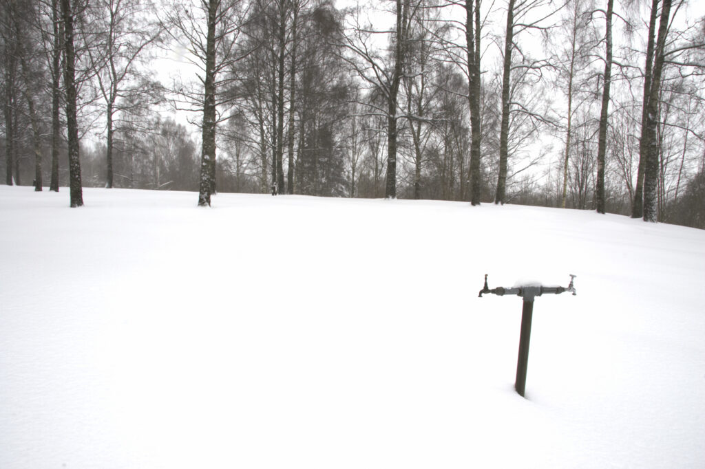 Norway, Oslo, Oslo City. Frozen water tap in the grounds of Bogstad camping in Oslo Forest near to Oslo city.