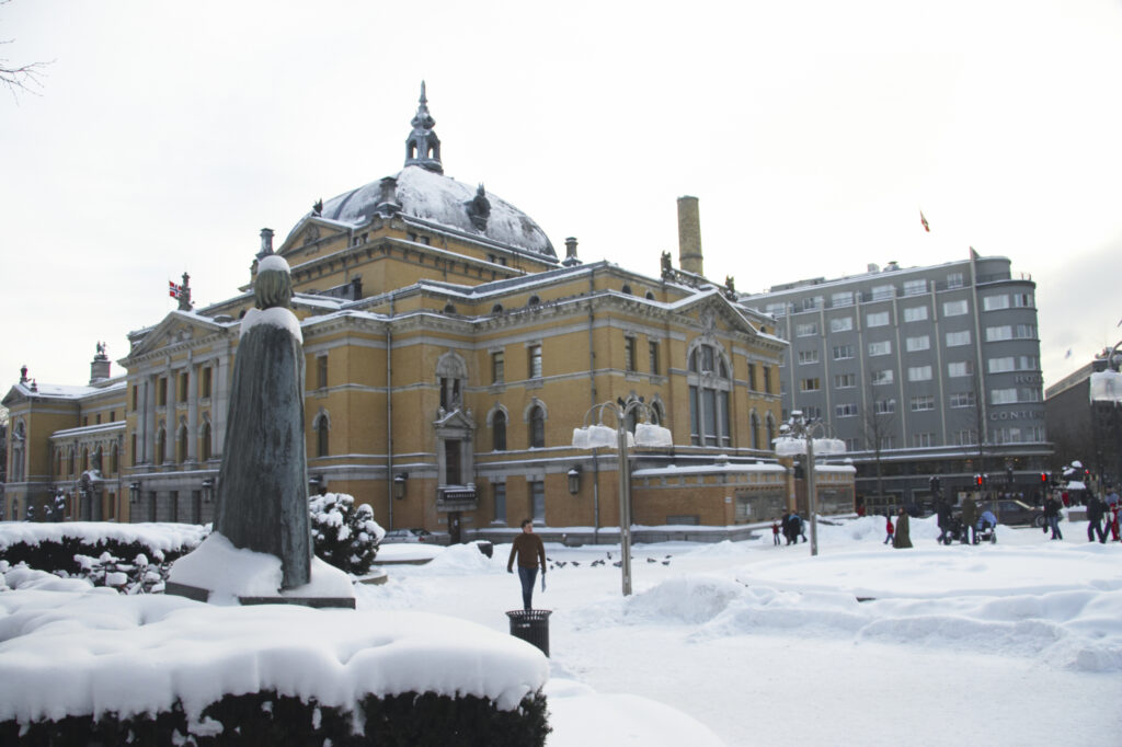 Norway, Oslo, Oslo City. The National Theatre and surrounding gardens and statues, transformed by a winter snowfall.