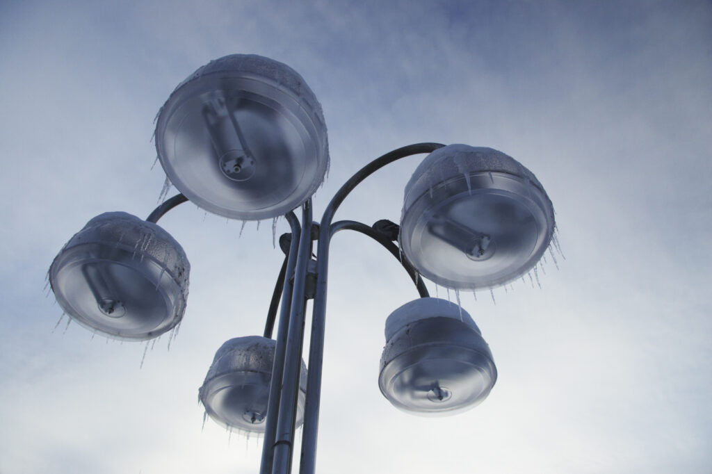 Norway, Oslo, Oslo City. Ice on street lights near to the National theatre in the city of Oslo.
