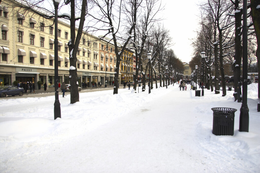 Norway, Oslo, Oslo City. A fresh snowfall transforms the tree lined Karl Johan Street in the city of Oslo.