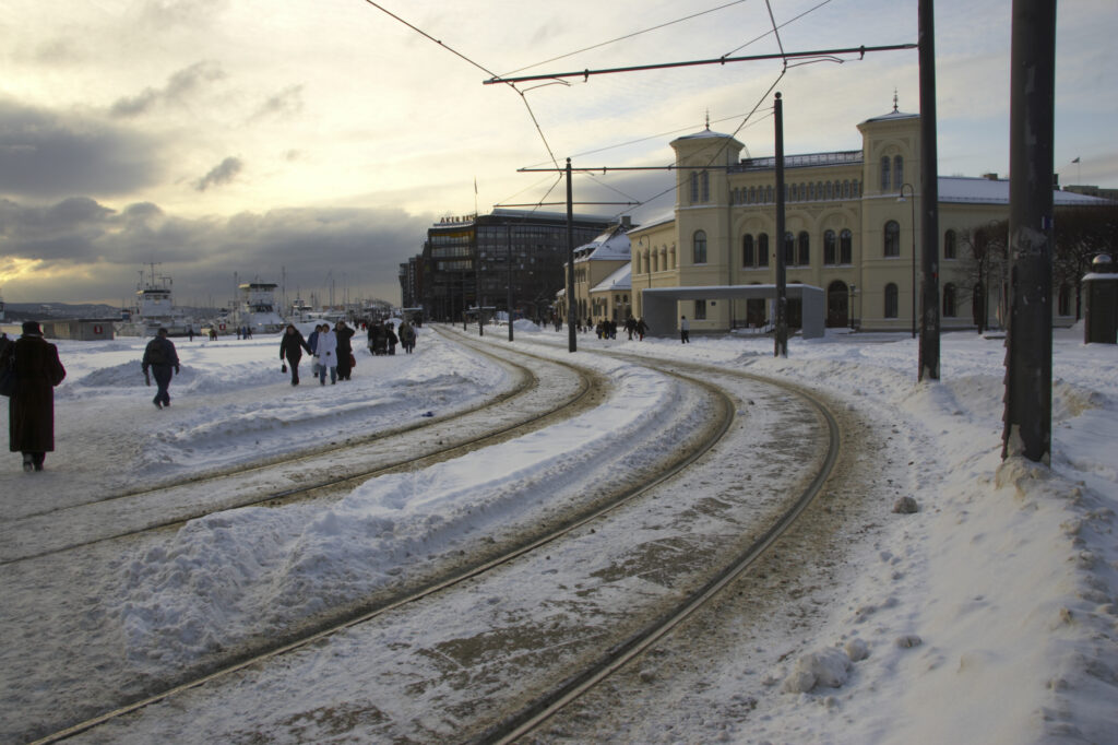 Norway, Oslo, Oslo City. Tram lines and the modern architecture of the Nobel Peace Center near Aker Quay, in Oslo city.