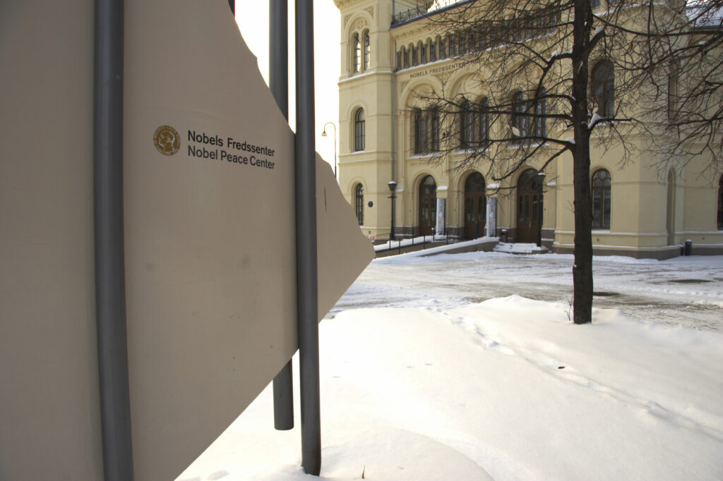 Norway, Oslo, Oslo City. A simple yet modern sign points to the Nobel Peace Center in Oslo.