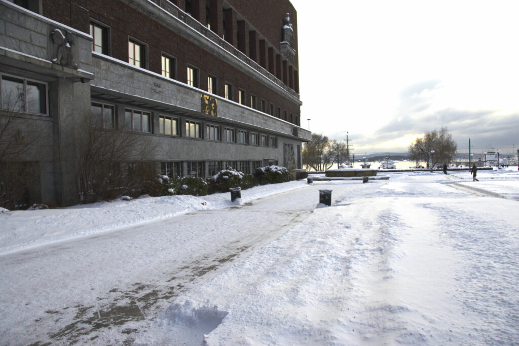 Norway, Oslo, Oslo City. Oslo city hall and surrounding park, transformed by a winter snowfall.