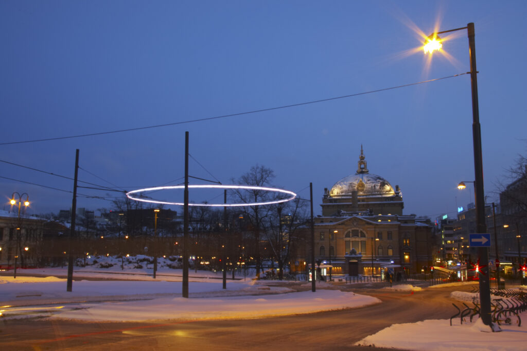 Norway, Oslo, Oslo City. Traffic trails running through a cityscape scene near the National Theatre in Oslo City / Oslo region.