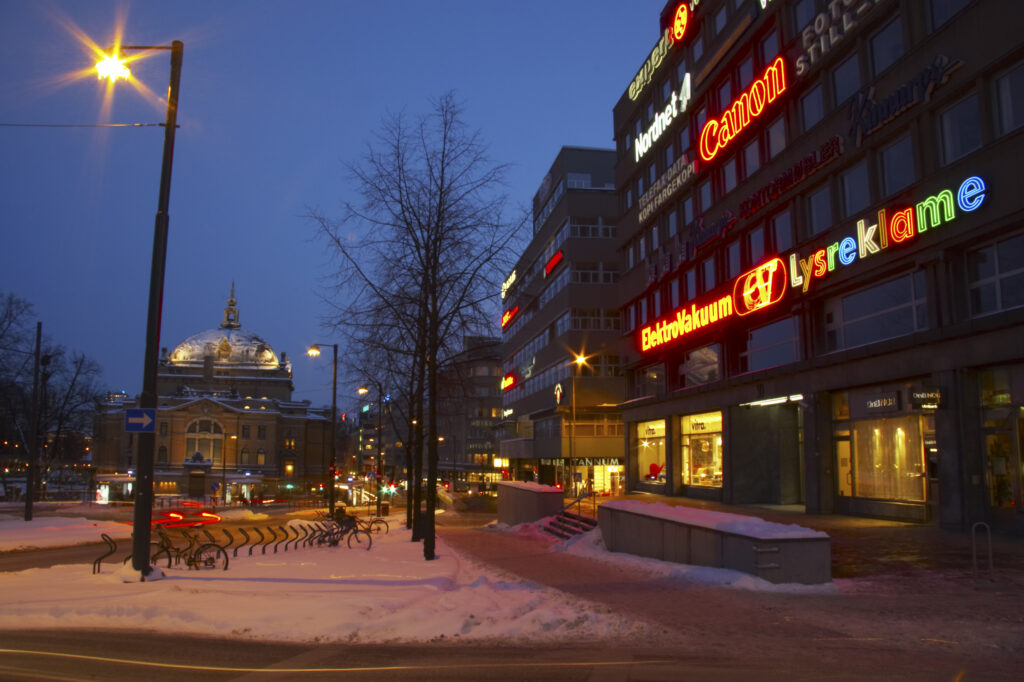 Norway, Oslo, Oslo City. Traffic trails running through a cityscape scene near the National Theatre in Oslo City / Oslo region.