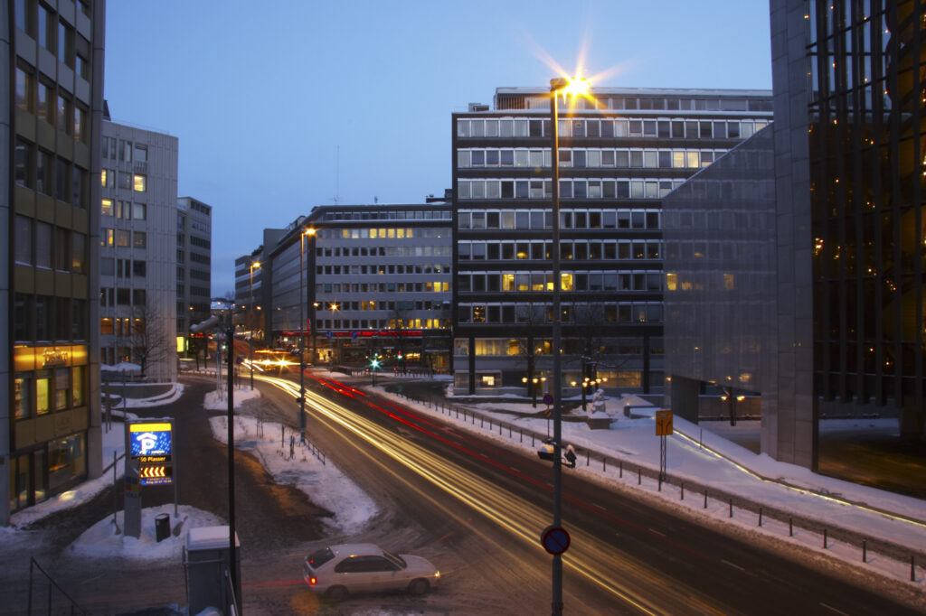 Norway, Oslo, Oslo City. Traffic trails running through a cityscape scene of Oslo City, in the Oslo region, captured at dusk.